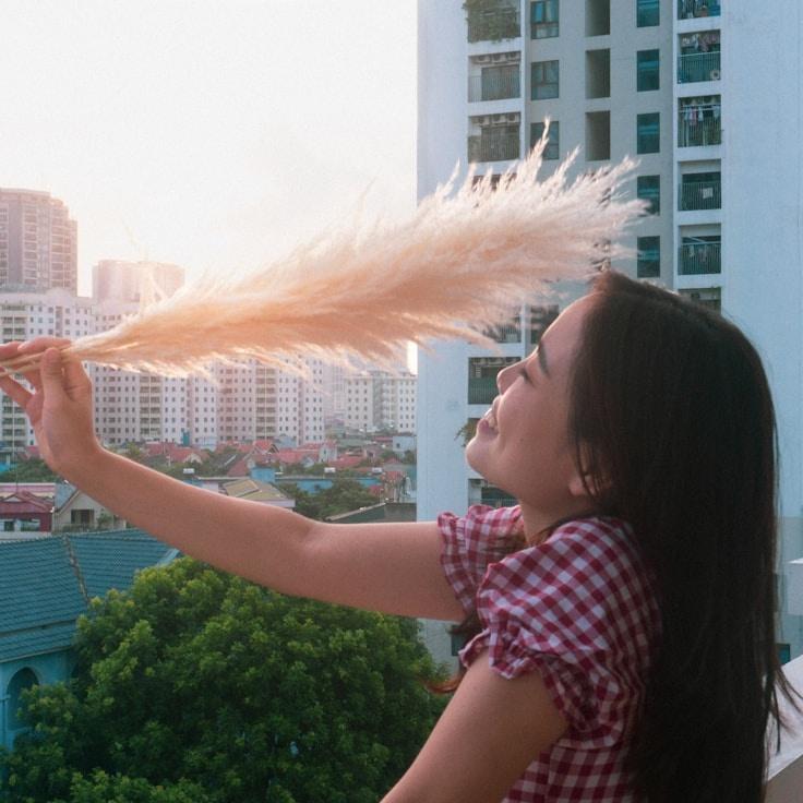 Kaveri Mehta, Lead Design Curator at UrbanOrbitHarvest, reviewing corporate floral arrangements